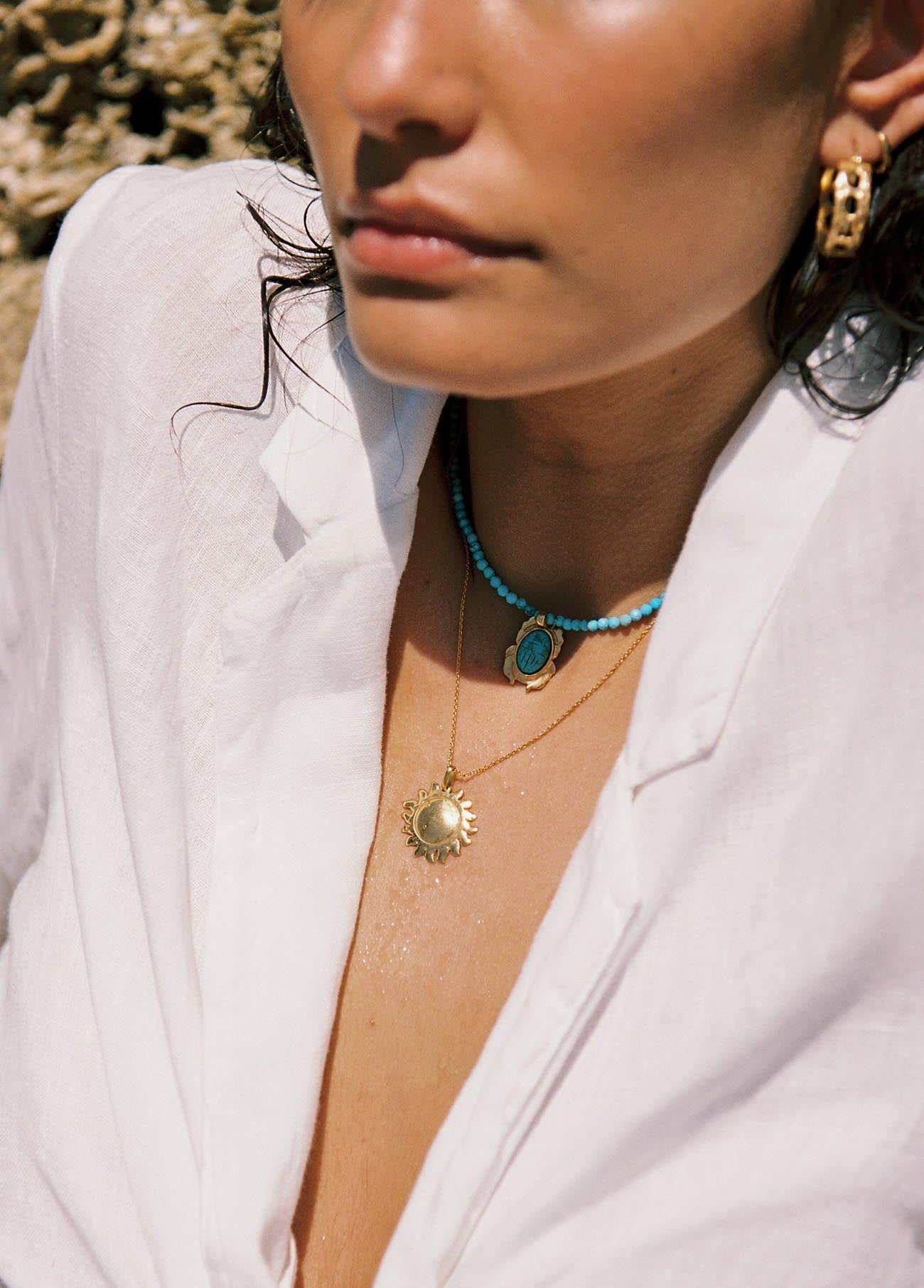Turquoise choker with nefer charm and gold chain with a gold sun charm